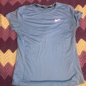 Nike workout top fits more like a small